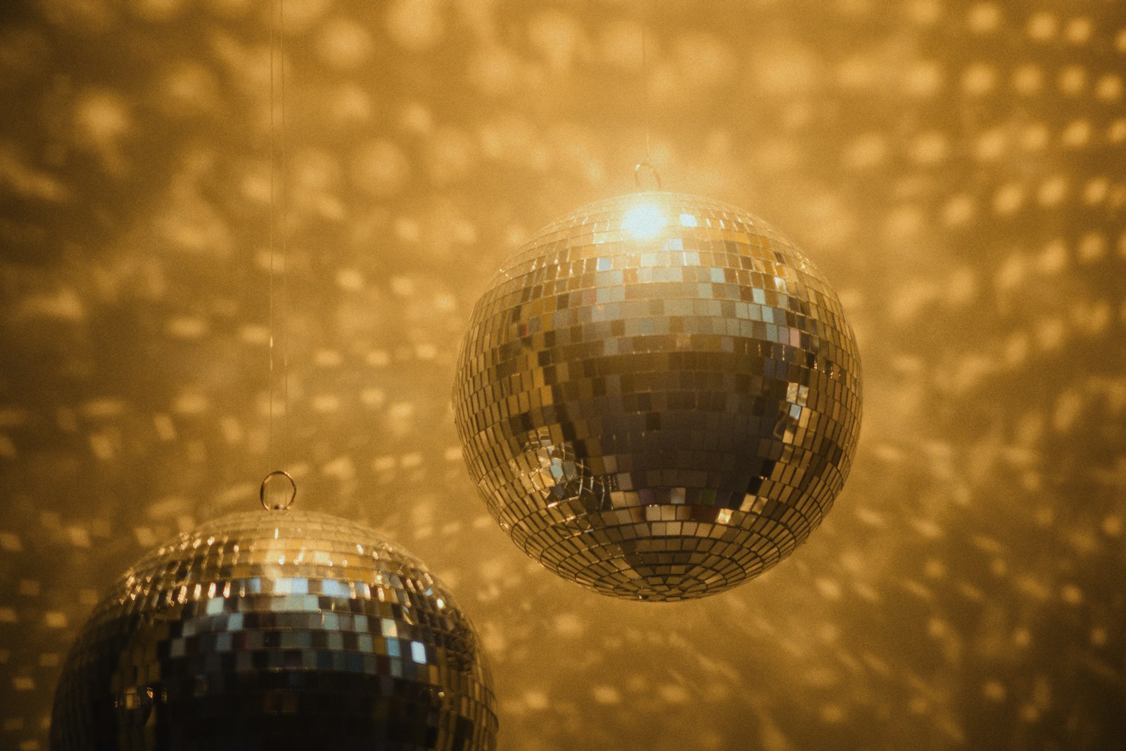 Disco balls shine light and reflect brightly.